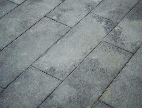 Grey pavement bricks arranged diagonally